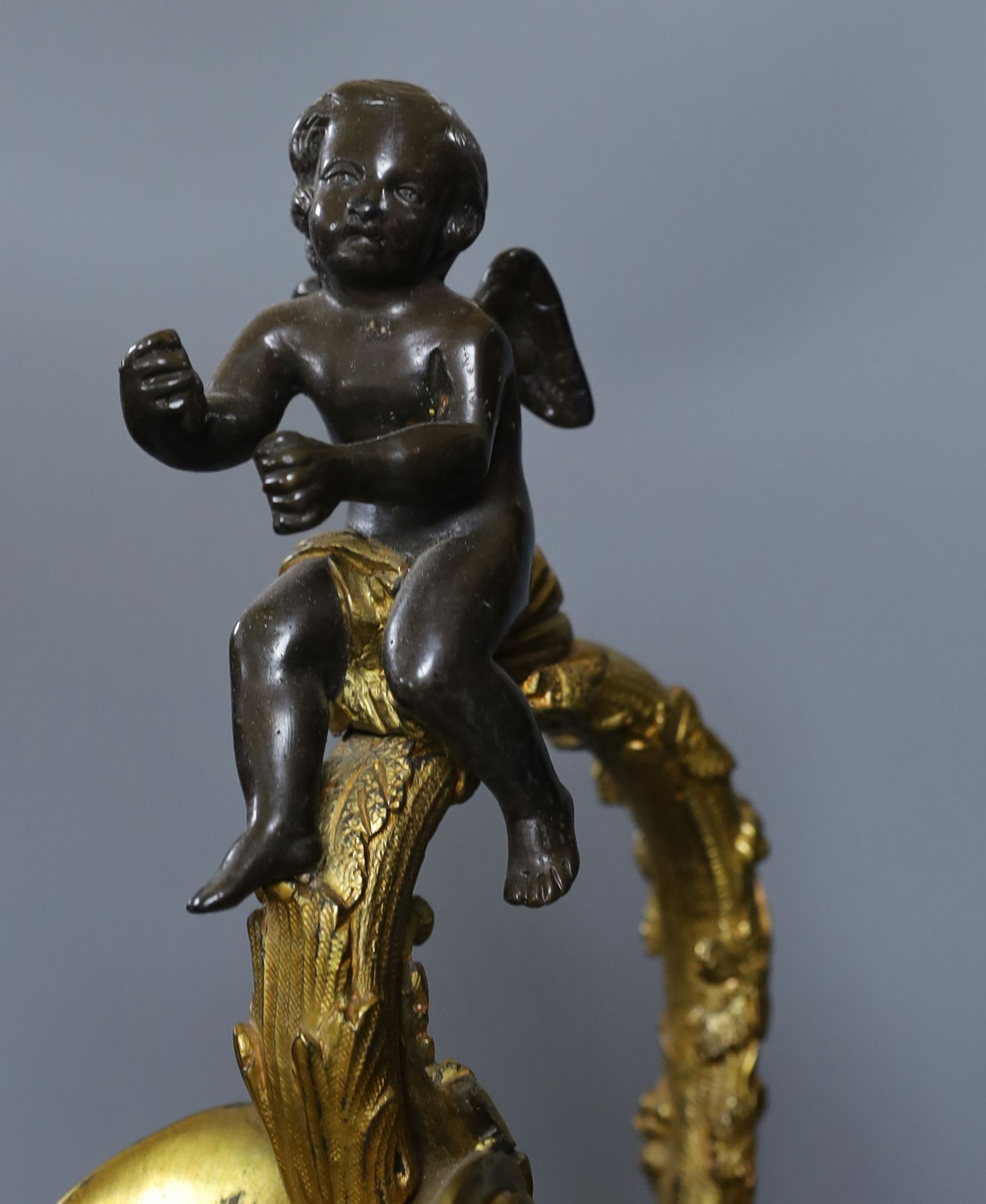 A large decorative bronze and ormolu 'ewer' lamp with seated cherub - 75.5cm tall
